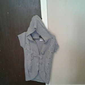 I'm selling a gray sleeveless sweater.